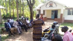 Trained community volunteer sensitizing a baraza on human rights